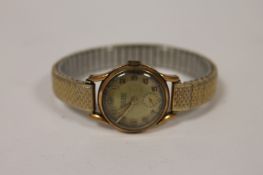 A 9ct gold Lady`s Rotary Maximus wrist watch. Fair condition, on expansion strap.
