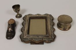 A silver dressing table pot, Birmingham 1950, together with a silver photograph frame, a silver