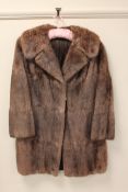 A brown mink fur coat, length 90 cm. Good condition.