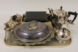 A three piece silver plated tea service, together with a quantity of cutlery and other silver plated