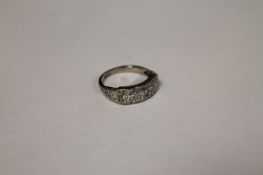 An 18ct white gold diamond half eternity ring. Good condition.