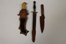 A High Life dagger with scabbard, together with a Japanese pocket knife and continental hunting