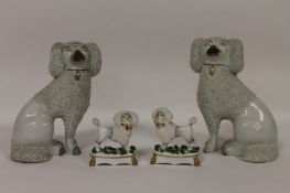 Two pairs of Staffordshire dog figures. (2) Some gilding slightly rubbed but otherwise good. Heights