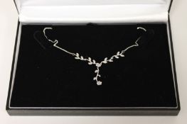 A 9ct white gold diamond necklace. Good condition.