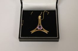 A 9ct gold amethyst pendant on chain. Good condition.