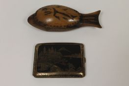 A treen box in the form of a fish, together with a Japanese Komai style metal cigarette case