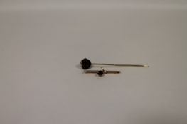 A 9ct gold bar brooch, together with an Edwardian hat pin. (2) In good condition, the hat pin is