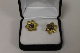 A pair of 9ct gold and sapphire flower earrings. (2) Good condition.
