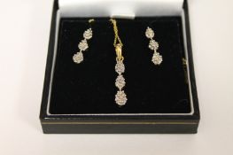 A pair of 9ct gold diamond drop earrings, together with matching pendant with necklace. (3) Good