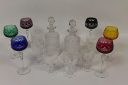 Six coloured crystal wine glasses, together with a pair of Edwardian crystal decanters and six