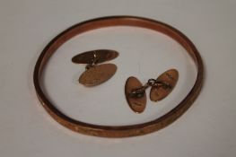 A 9ct gold bangle, together with pair of 9ct gold cufflinks. (3) 12.6g. Bangle slightly misshaped