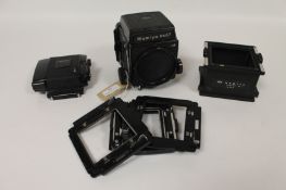 A Mamiya RB 67 Professional series, together with spacers etc. (Q) Good condition.