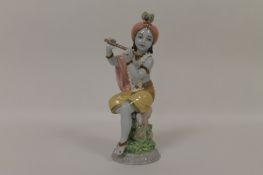 A Lladro figure depicting a musician, height 21.5 cm. Good condition.