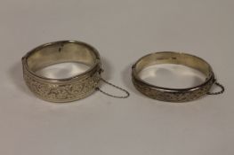 Two silver bangles, Birmingham 1962 & 1958. (2) With a combined weight of 79.8g. Condition good.