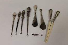 A pair of silver and ivory glove stretchers, Birmingham 1903, together with five silver topped