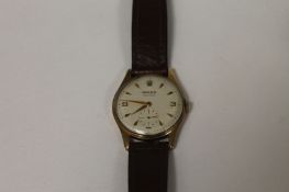 A 9ct gold Gentleman`s Rolex Precision wrist watch, boxed. Good condition, mid twentieth century,