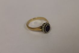 A 9ct gold amethyst and diamond ring. Good condition.