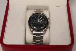 An Omega Speedmaster Professional Gentleman`s Moon watch, with documents, boxed. Excellent