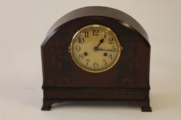An Edwardian mahogany striking mantle clock, height 30 cm. Good condition with pendulum and key.