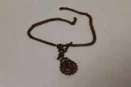 A 9ct gold pocket watch chain and fob, 31.9g. (2) Good condition.