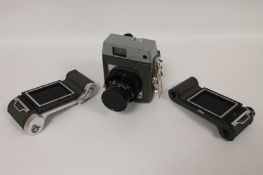 A Mamiya press camera, no. 2815890, with Sekor 100mm lens, No. 58399, Sekor 90mm lens, No.