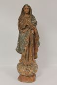 A nineteenth century carved sculpture depicting the virgin Mary, height 78 cm. Originally polychrome