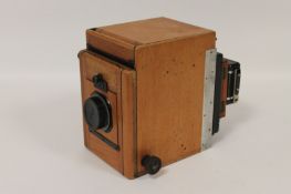 An antique plate camera, with Aldis f74.5 lens, No. 102799, cased. With no clear manufacture or