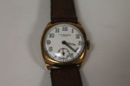 A 9ct gold Gentleman`s wrist watch by J.W.Benson. Good condition, the reverse reading `William B