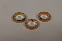 Three 9ct gold wedding bands, 11.4g. (3) Good condition.