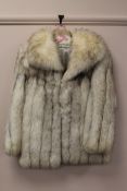 An Arctic white fox fur coat, length 76 cm. Excellent condition.