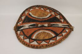 A Massai animal hide dance shield, width 50 cm. Good condition, early twentieth century.