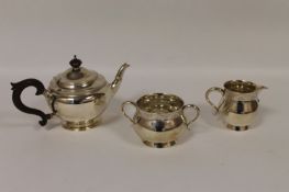 A three piece silver tea service, London 1932, 27 oz. (3) Good condition.