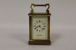 A brass carriage clock by Mappin & Webb, with key. Good condition.