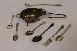 A silver sauce boat, Birmingham 1924, together with eight items of silver cutlery. (9) Good