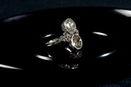 An Art Deco two stone diamond ring, set in platinum, the old European cut diamond weights of 2.