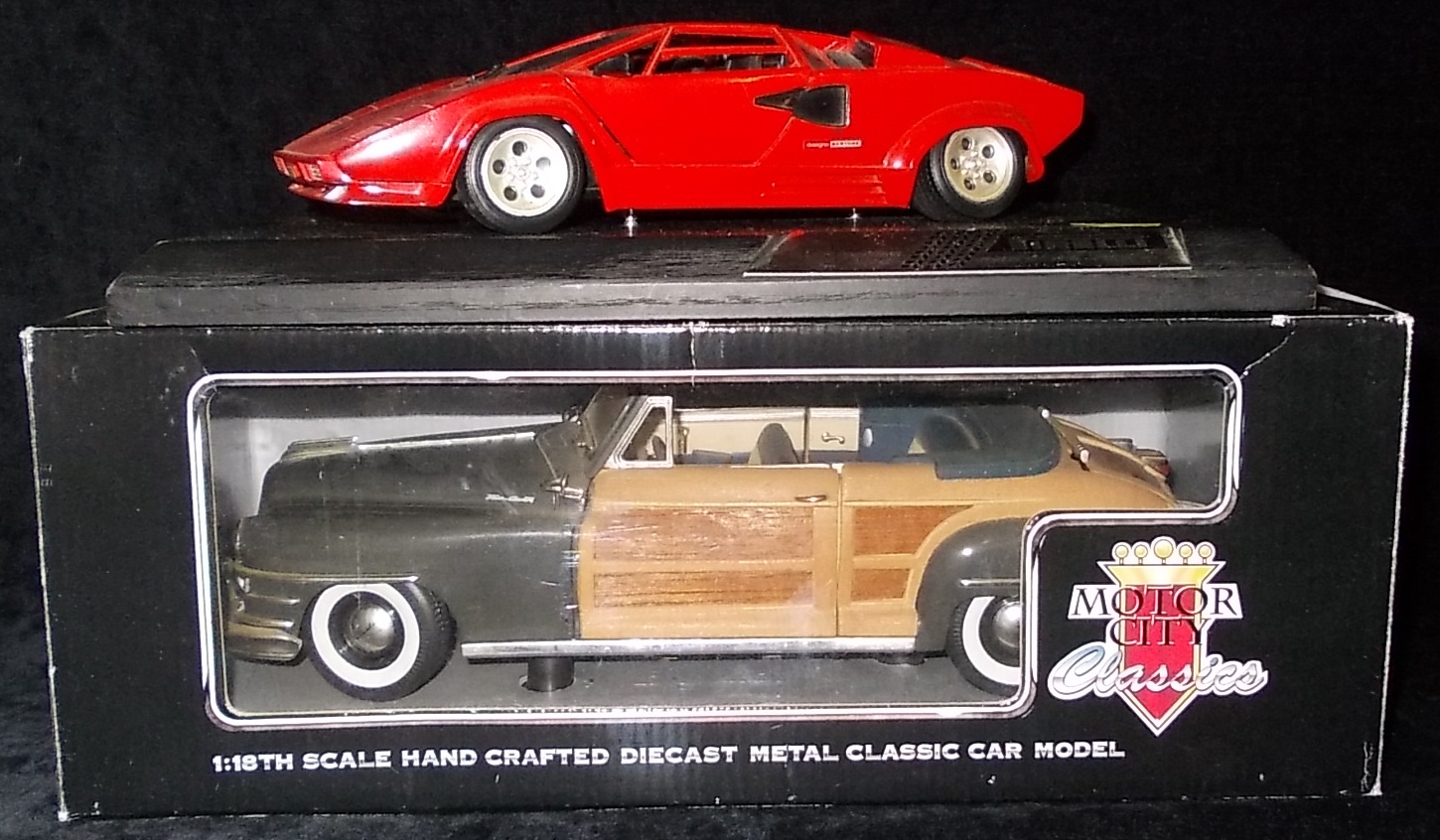 (2) Motor City Classics. 1:18 die-cast vehicle. Boxed. Also mounted, un-boxed Lamborghini model.