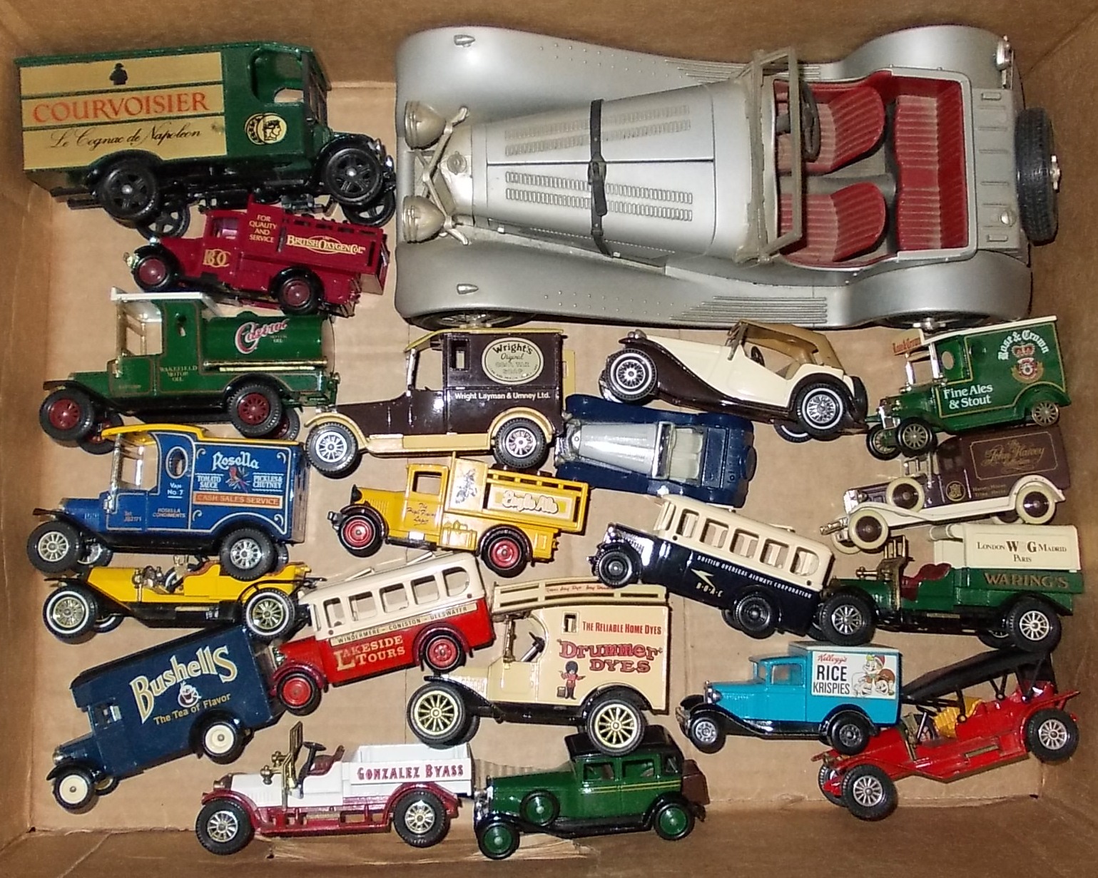 Box of various die-cast vehicles.