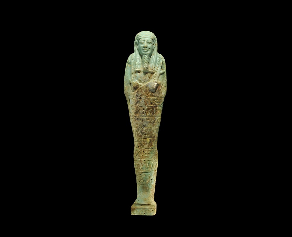 Egyptian Glazed Composition Hieroglyphic Shabti Saite Period, circa 624-525 BC . A slender pale