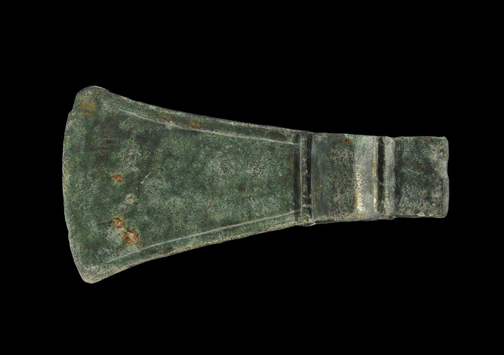 Bronze Age Bronze Axehead 2nd millennium BC . A cast bronze axehead with expanding blade ornamented