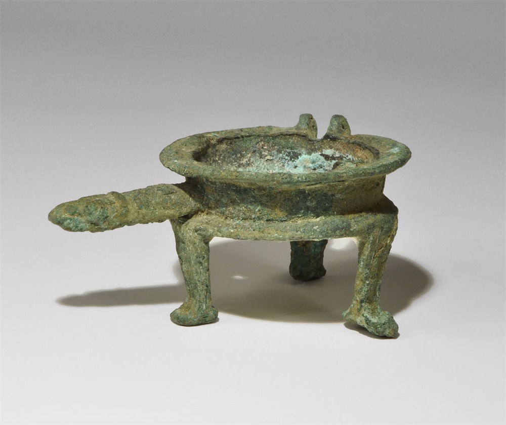 Near Eastern Luristan Tripod Lamp Bronze Age, 1250-650 BC . A cast vessel with three short L-shaped