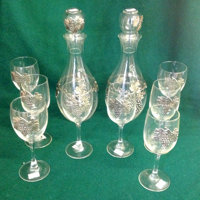 Pair of decanters with pewter grape decoration and eight matching glasses