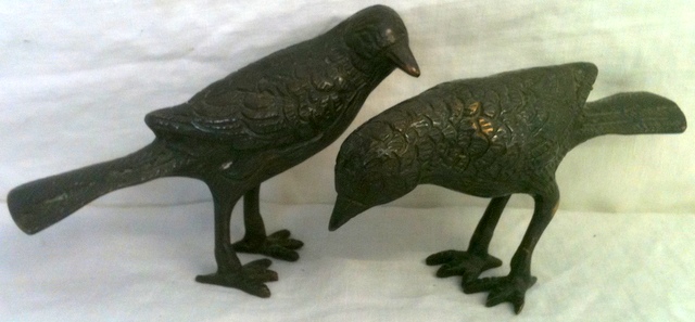 A pair of bronze birds