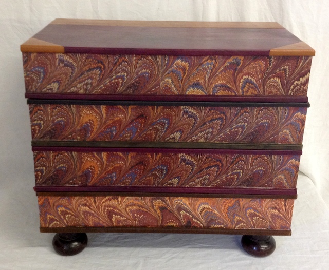 Contemporary table in the form of four large leather bound books with rising lid