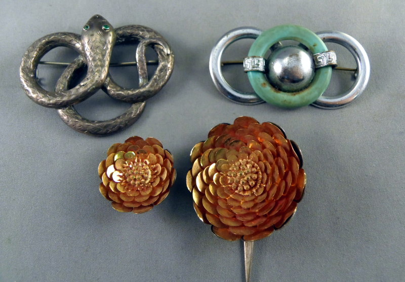 A Victorian silver snake brooch and others.