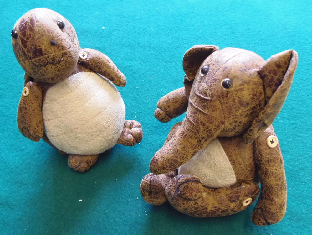 Two small soft animal doorstops.