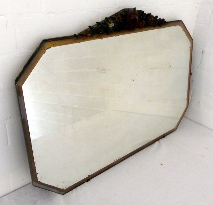 A rectangular 1940`s mirror with carved top.