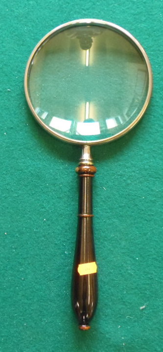 Silver plate 6" magnifying glass.