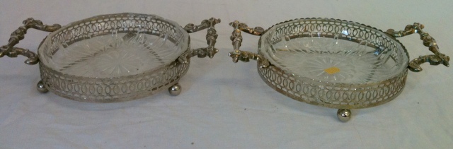 Silver plated dishes with glass liners.