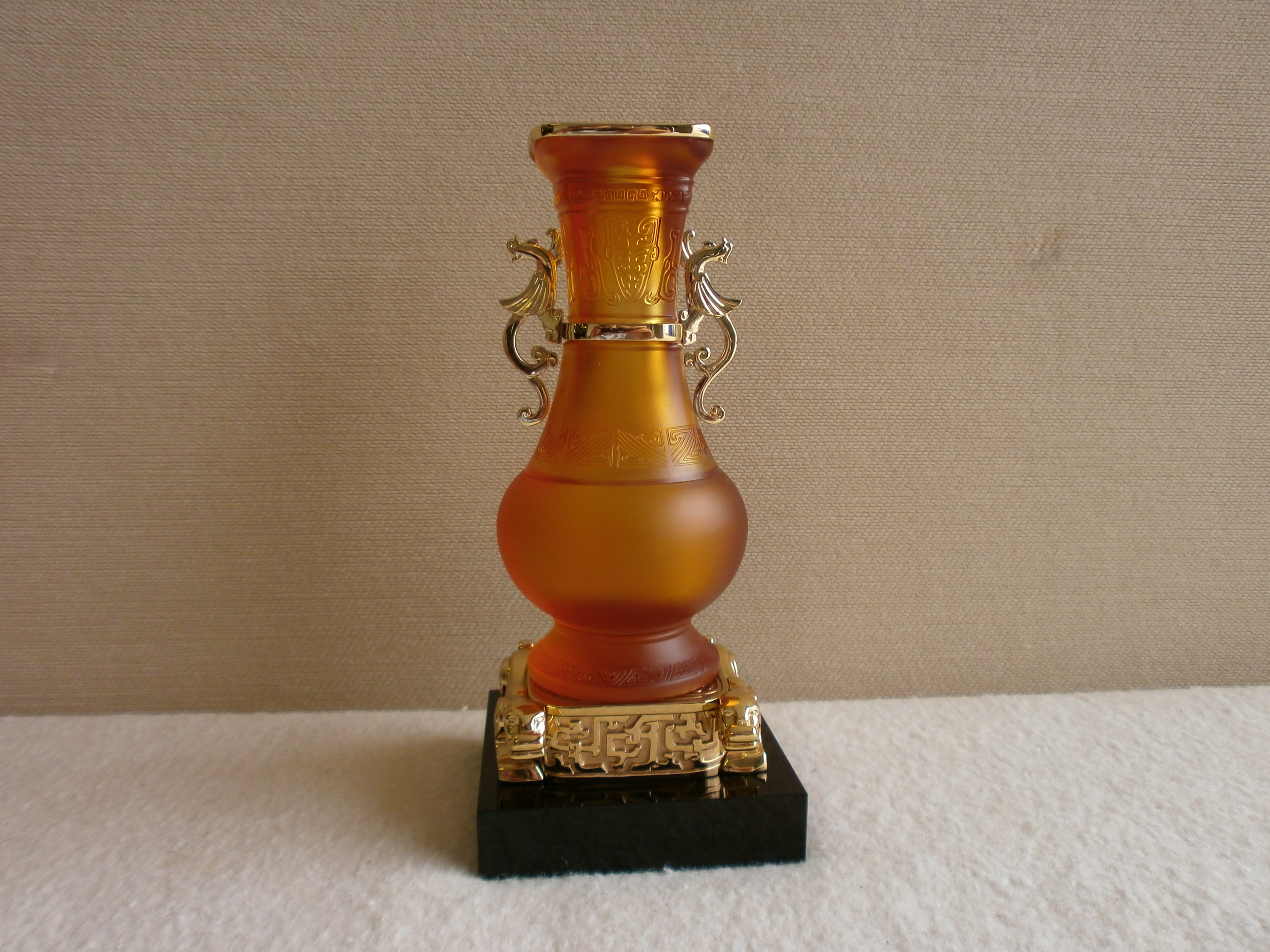 Oriental coloured glass vase on marble and yellow metal base signed Shenzhen to the base
