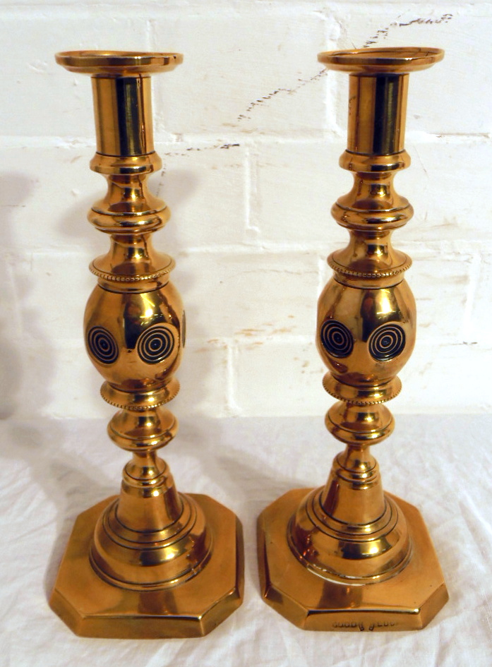 A pair of brass candlesticks.